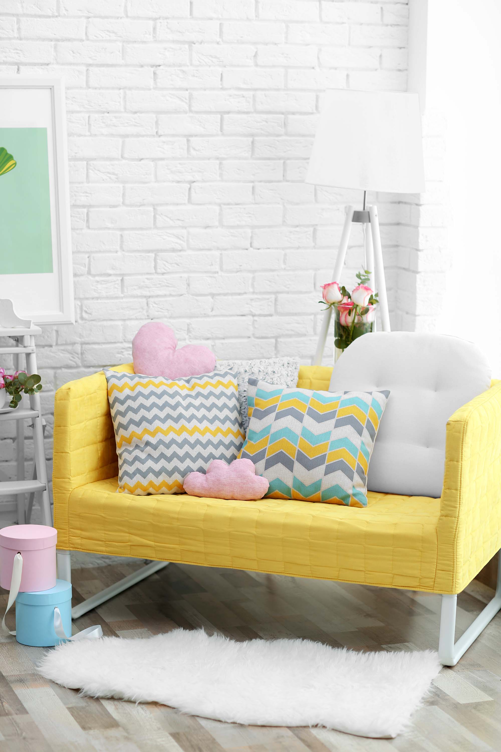 a bright yellow two seater sofa