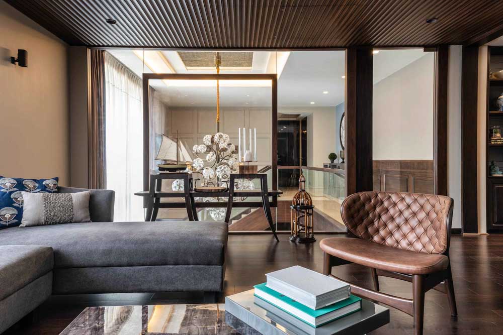 Duplex home design glass walls around the staircase - Beautiful Homes