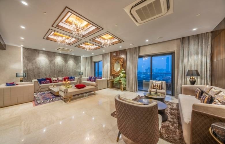 Two living spaces with rectangular & round center tables - Beautiful Homes