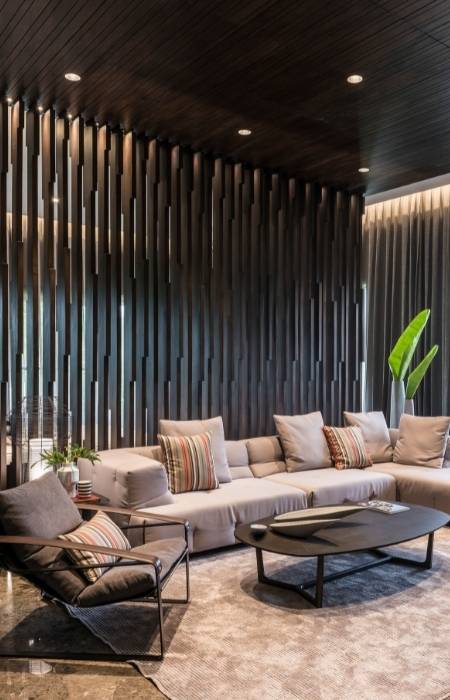 Modern furniture in a wall-paneled living room - Beautiful Homes