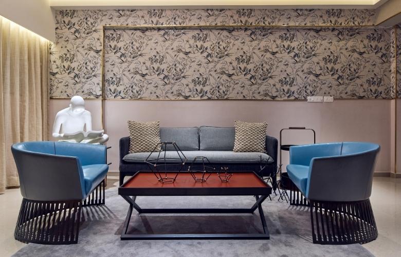 Living room with half wallpapered wall & half painted wall - Beautiful Homes