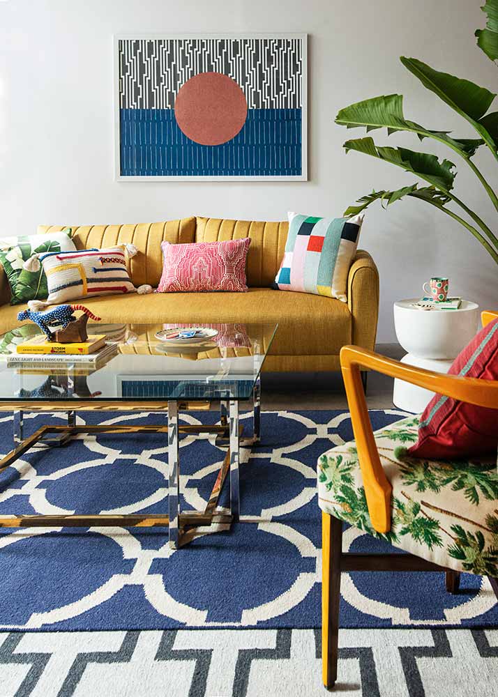 Living Room Décor Ideas With A Yellow Sofa, Arm Chair, Coffee Table, Carpets And Artwork - Beautiful Homes