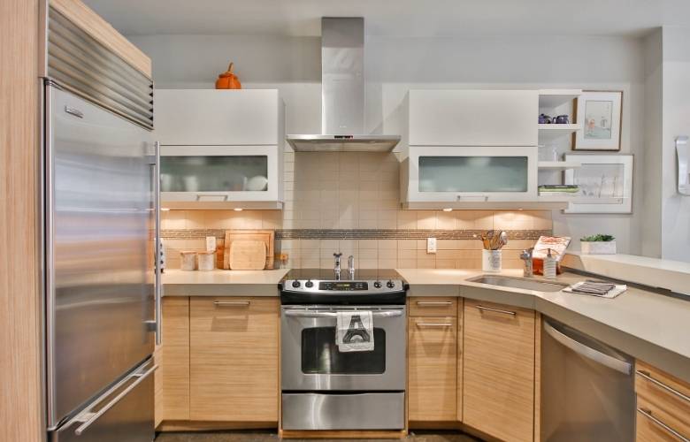 Modular kitchen with granite kitchen countertop & built-in kitchen appliances - Beautiful Homes