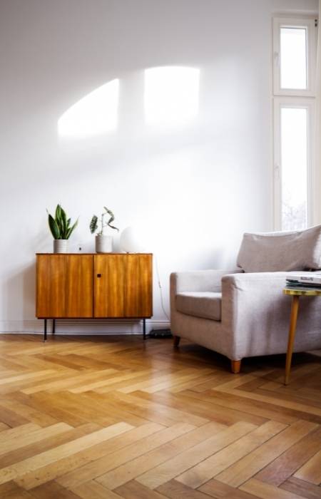 Engineered wood flooring with plywood cabinet in the living room - Beautiful Homes