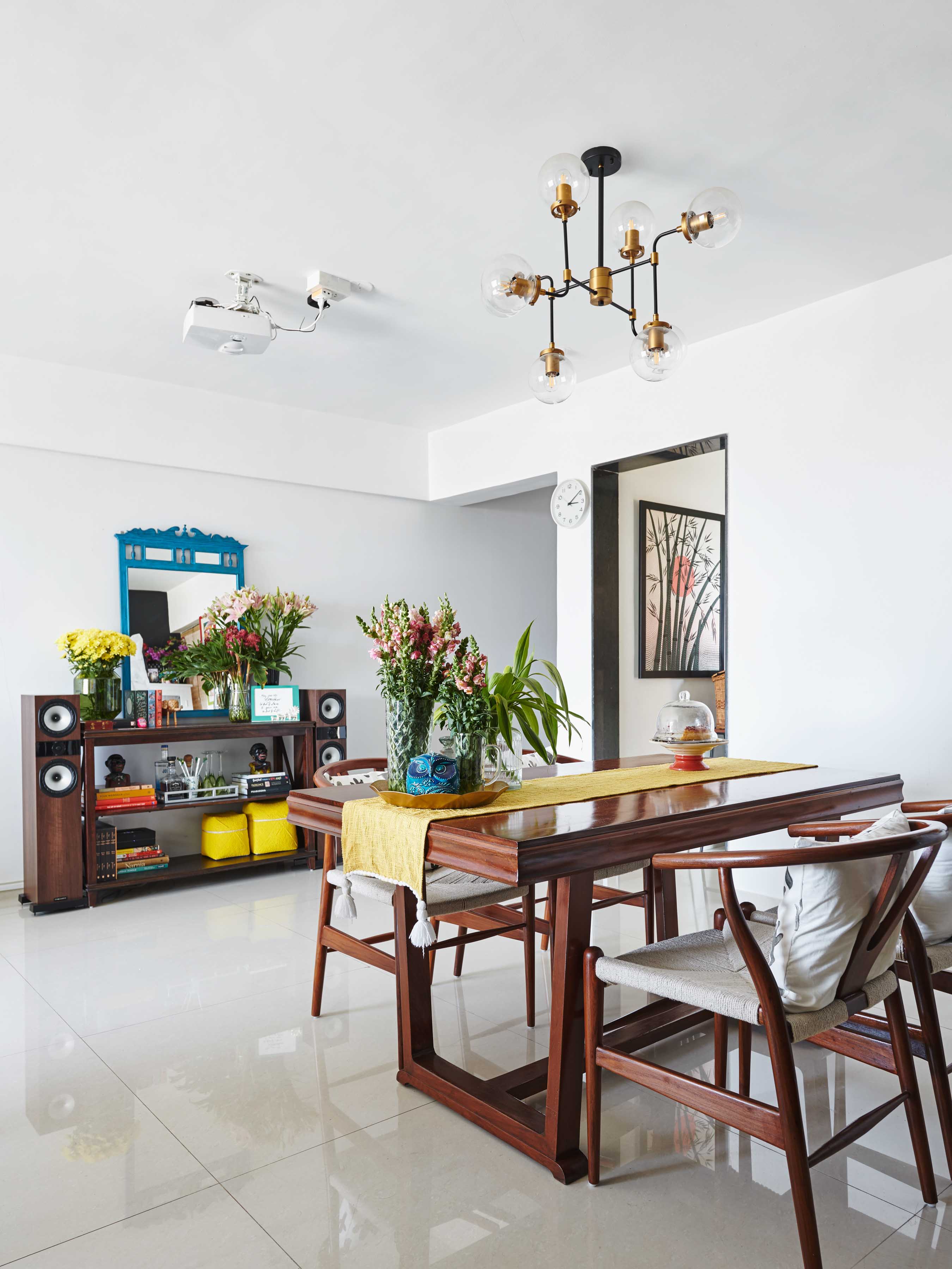 The dining area filled with the fresh flowers - Beautiful Homes