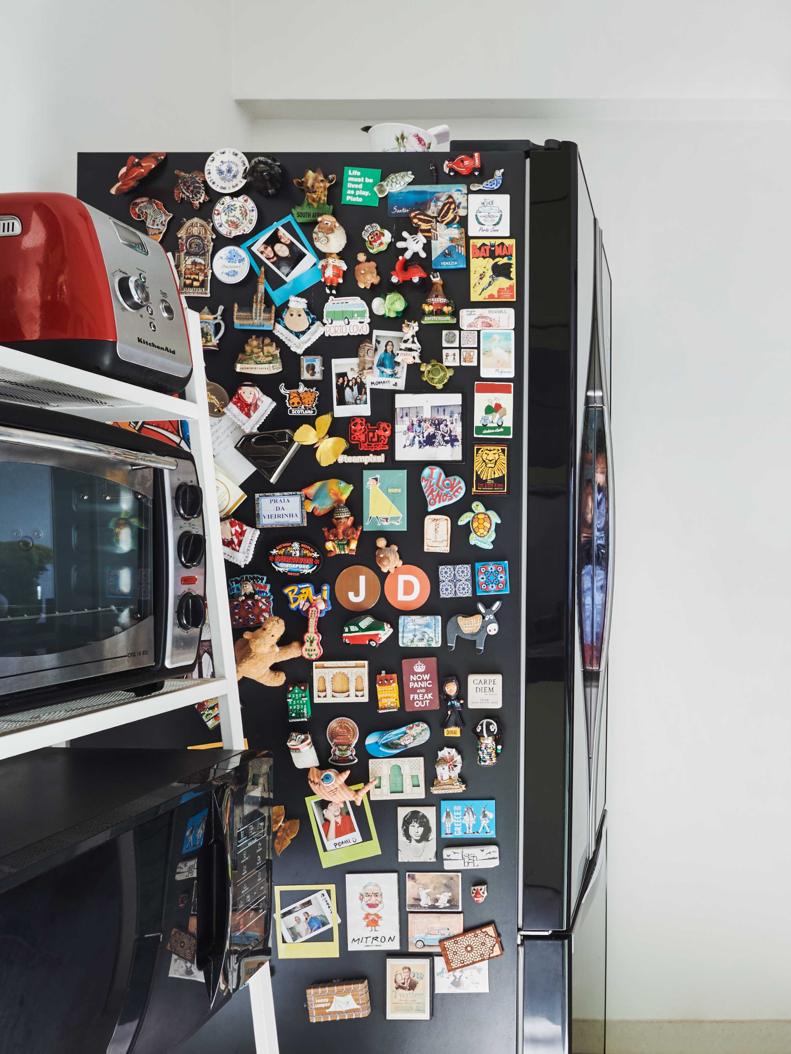 The fridge magnets collected from the destinations the couple visited on their travels - Beautiful Homes