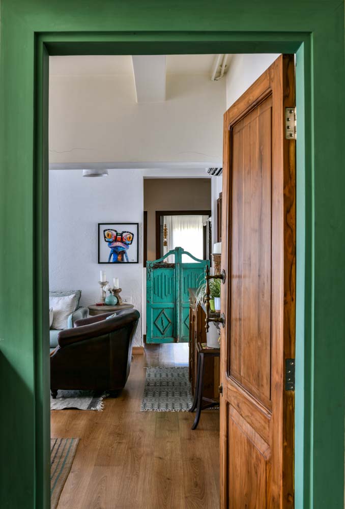 Interior of home with salon doors & rugs for distinct zones - Beautiful Homes