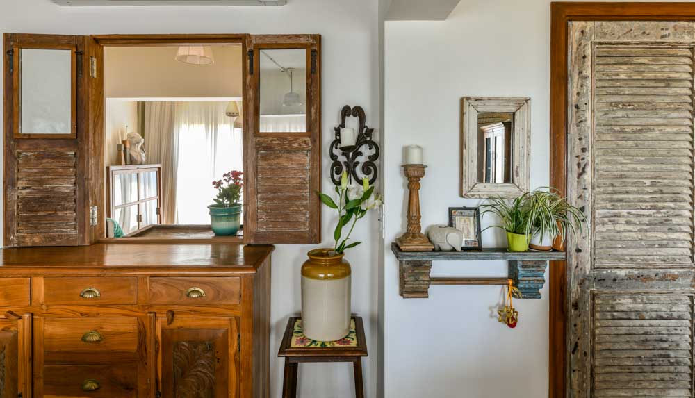 Interior decor of home done with recycled doors made of vintage furniture & artifacts - Beautiful Homes