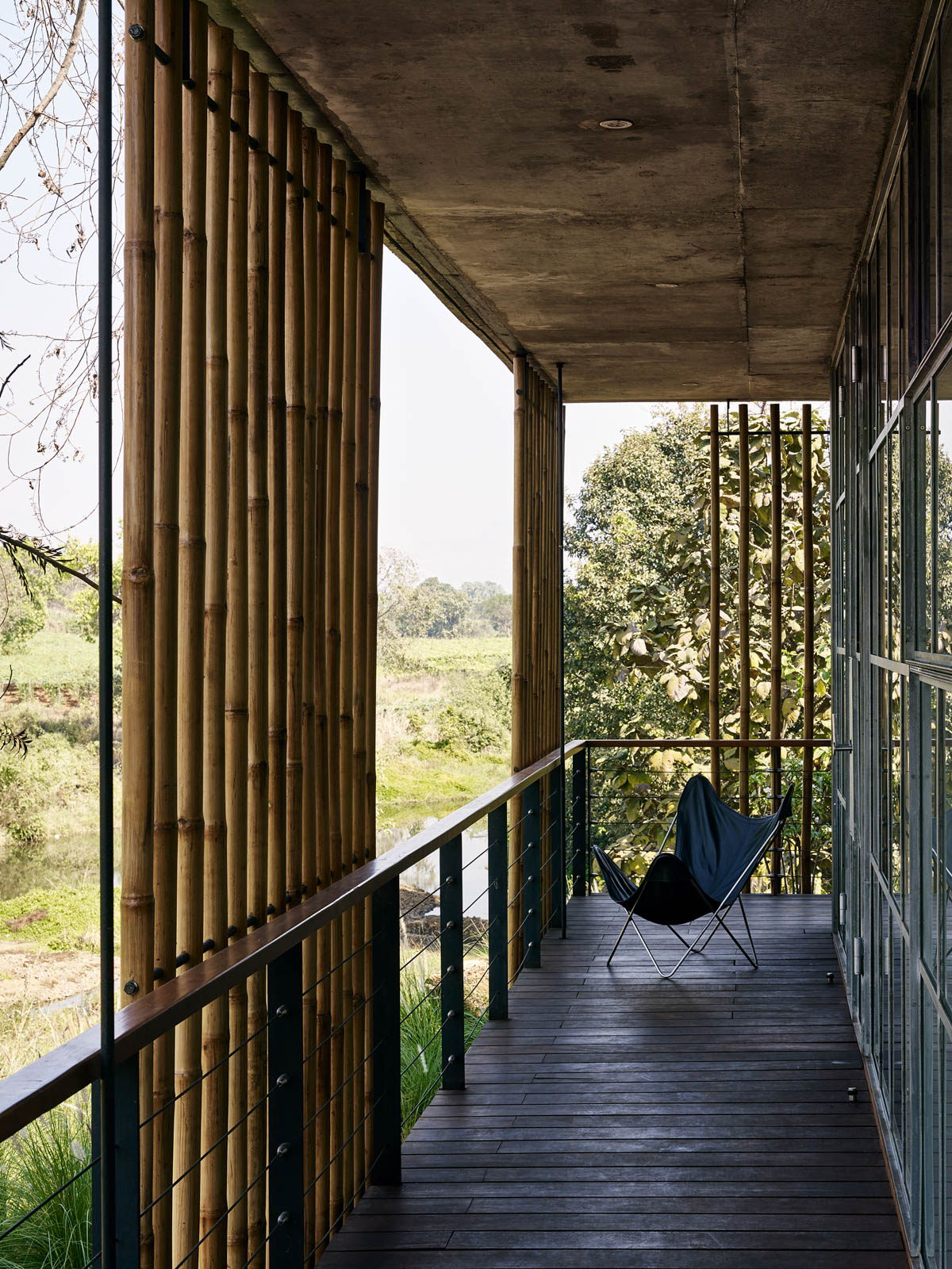 A Verandah with Buttefly Chair at Karjat House - Beautiful Homes