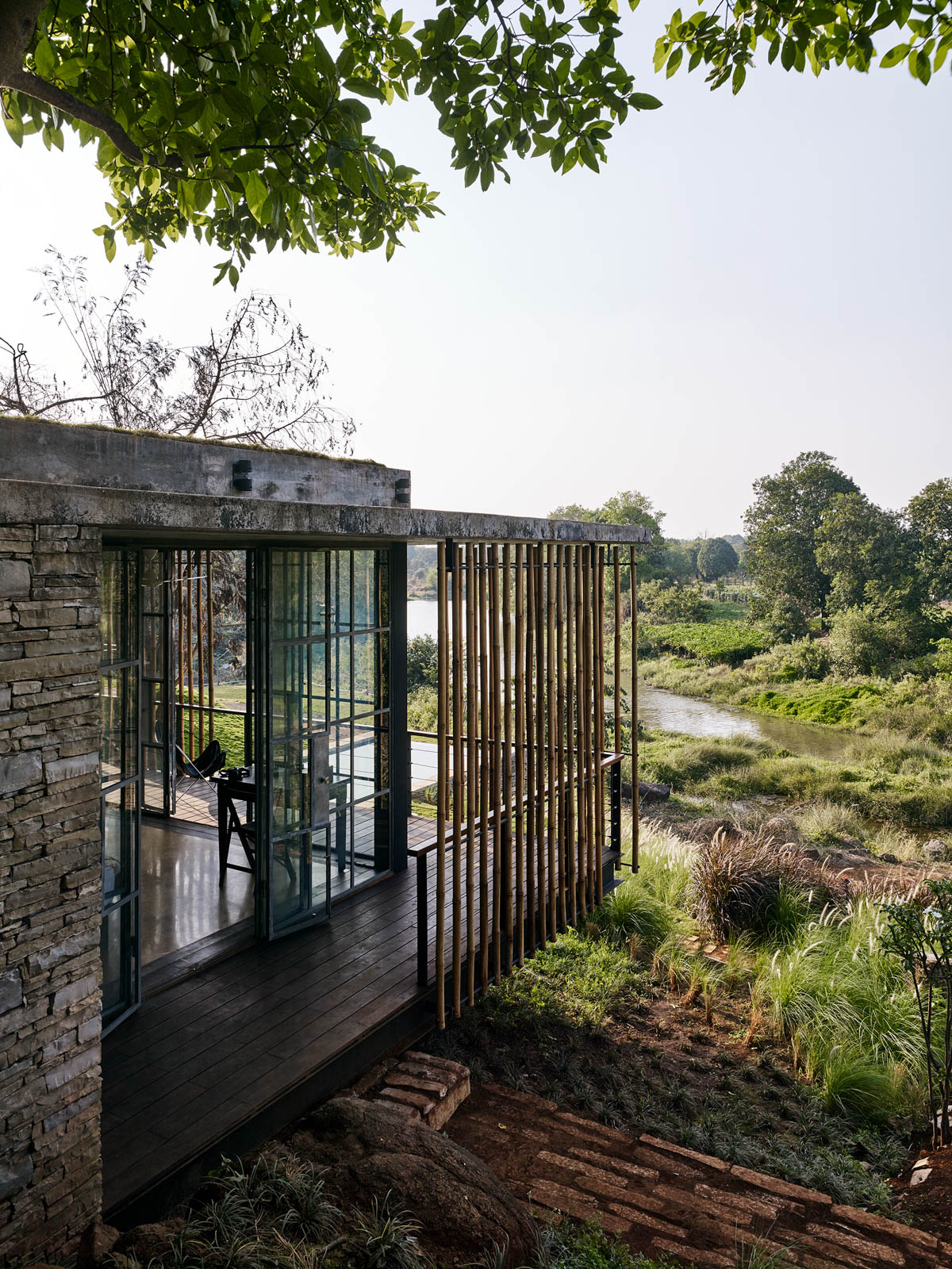 The View of Master Bedroom Verandah Pool and River Sequence at Karjat House - Beautiful Homes