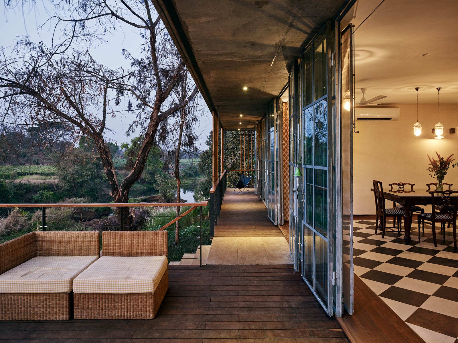 The View of Dining Room and Verandah During Sunset at Karjat House - Beautiful Homes