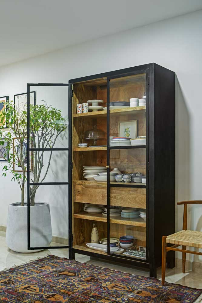 A wooden storage unit filled with cutlery