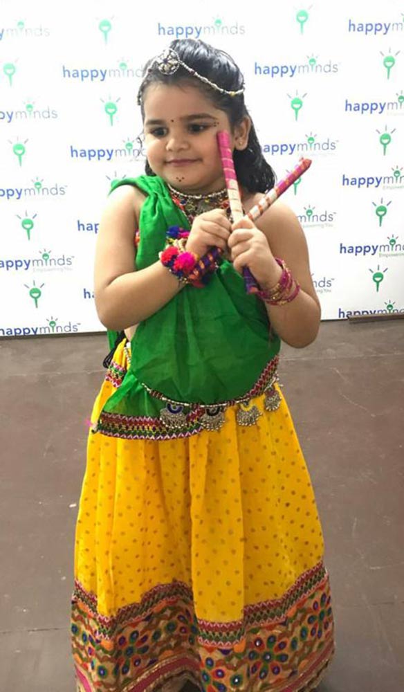 A young girl dressed in festive clothes