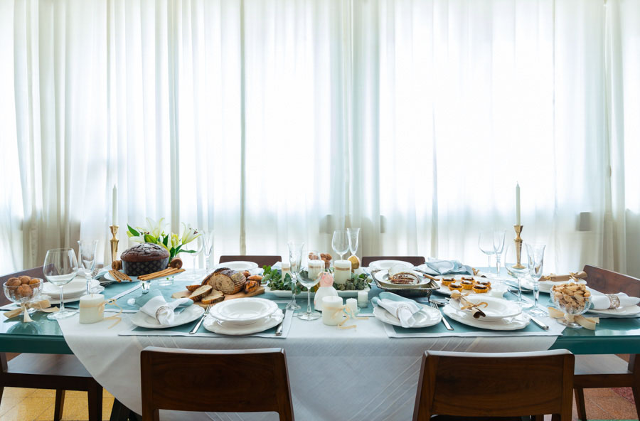 A table styled with crockery, cutlery and food