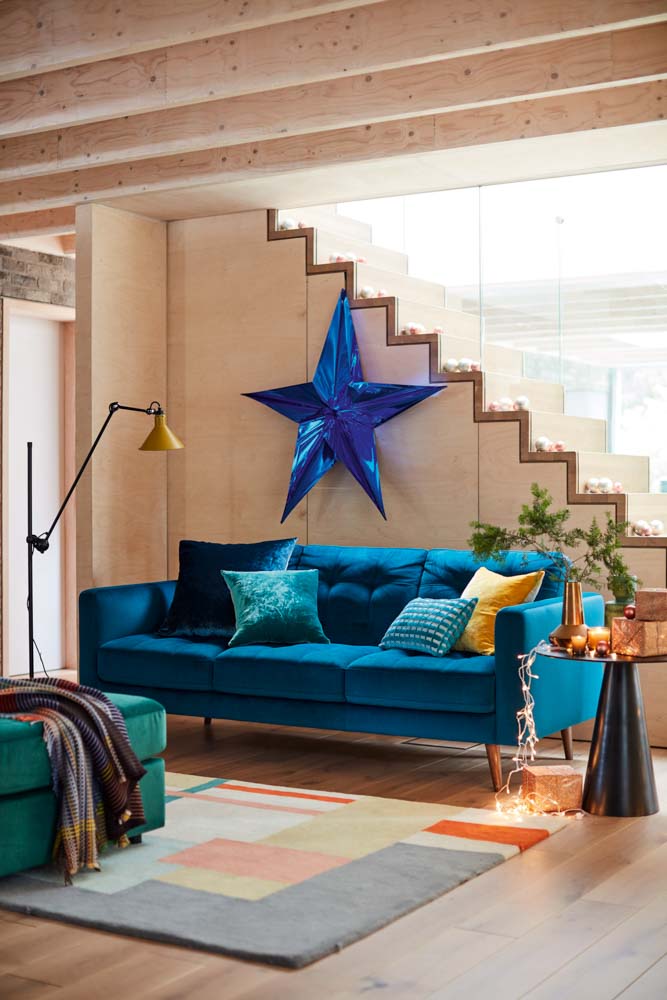 Simple home décor with fairy lights and a tray of pine cones for Christmas and New Year - Beautiful Homes