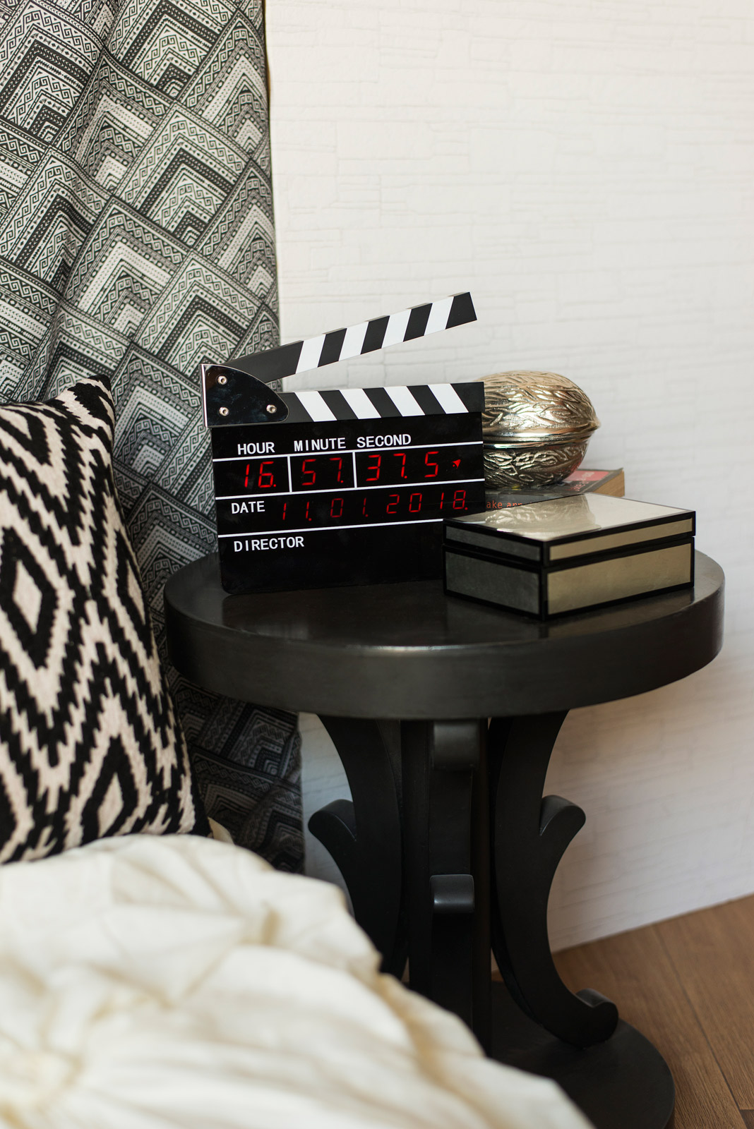 Small Monochromatic Bedroom Design With Side Table Topped with an Eclectic Pieces - Beautiful Homes
