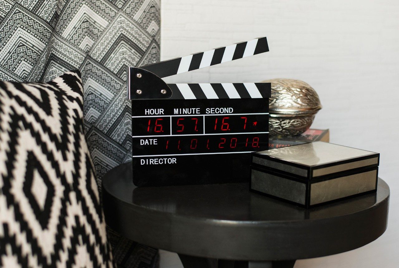 Small Monochromatic Bedroom Design in Black & White Colour Combination With Table Clock - Beautiful Homes