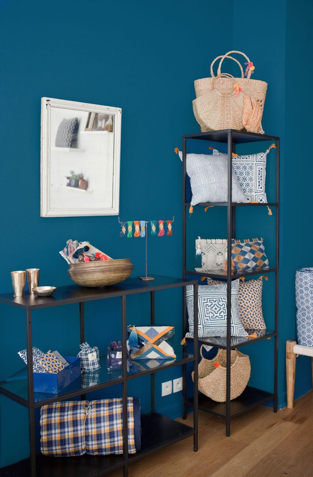 The wooden flooring of the Jamini Design store complements the blue wall palette - Beautiful Homes