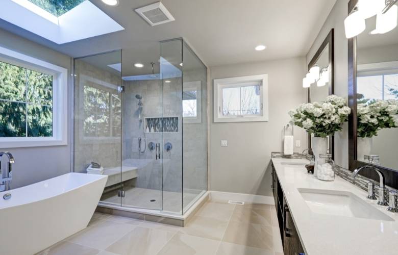 Large bathroom design with wash basin space, sleek bath tub & shower cubicle - Beautiful Homes