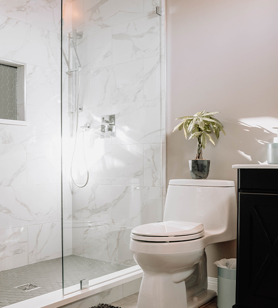 A frameless glass shower cubicle for a simple bathroom design - Beautiful Homes