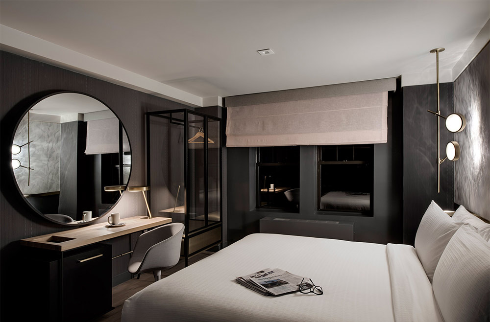 All-black bedroom ideas with round mirror - Beautiful Homes