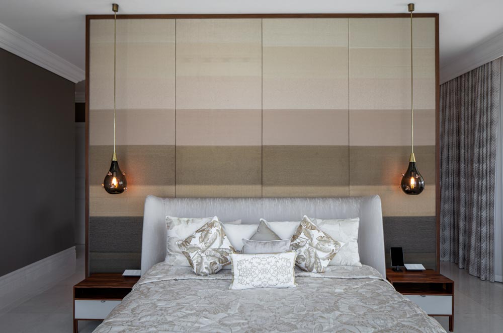 Elegant hanging side lamps matching with the colours in the background - Beautiful Homes