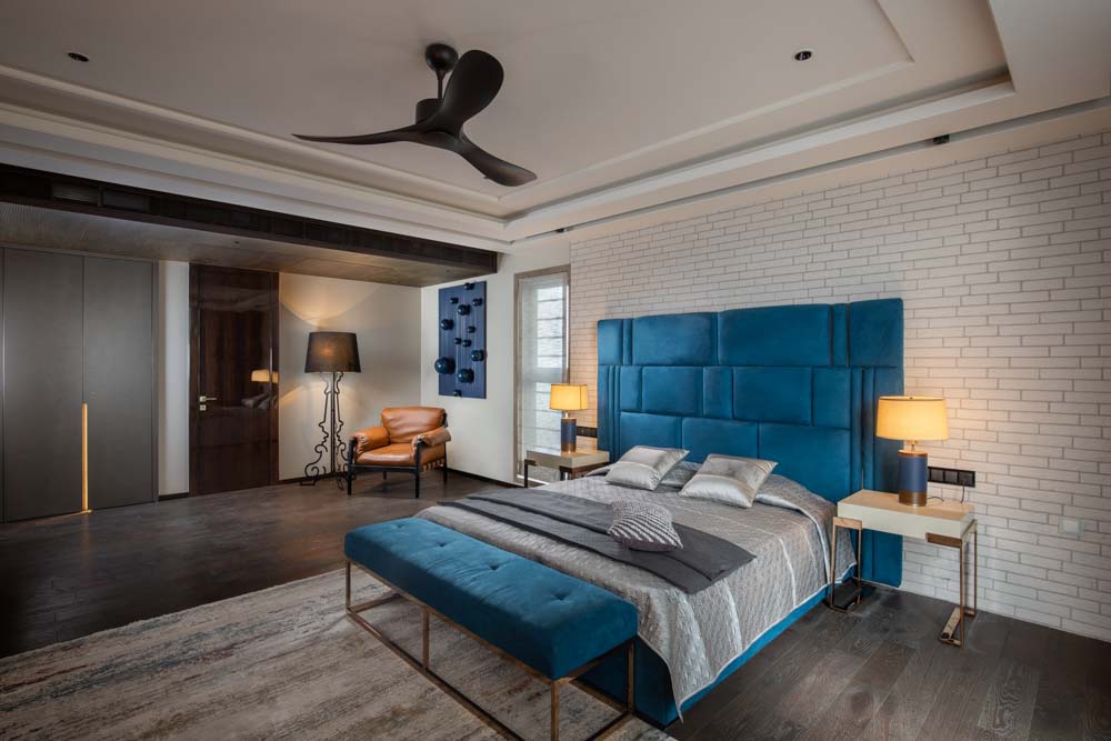 Metal frame floor lamp adds ethereal contrast to the bedroom décor  - Beautiful Homes