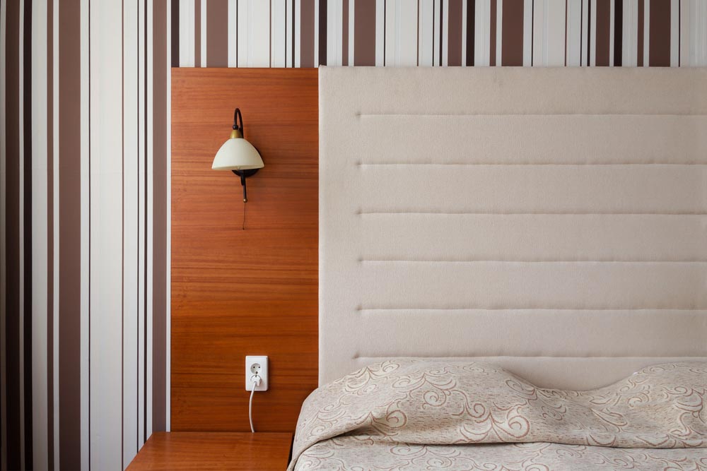 Coffee coloured vertical pinstriped wallpaper for bedroom wall design - Beautiful Homes