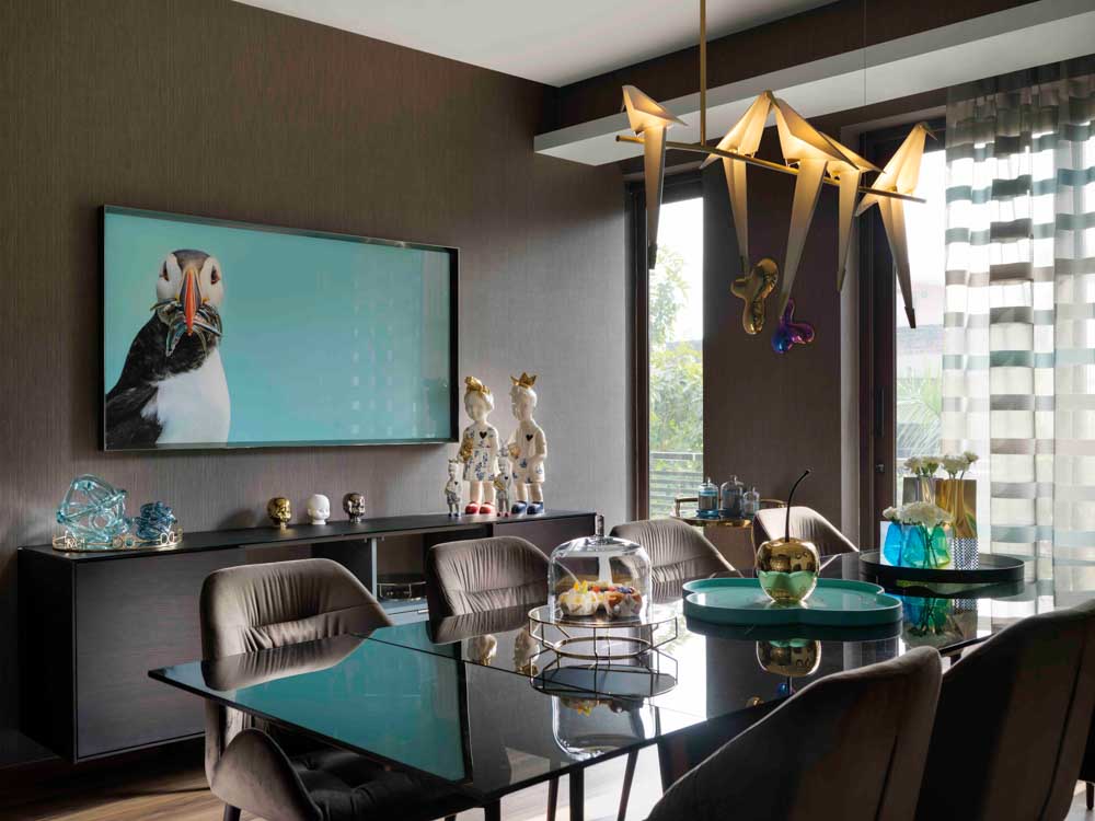 Beautiful dining room design in gray & teal colour shades with artefacts for dining room decor - Beautiful Homes