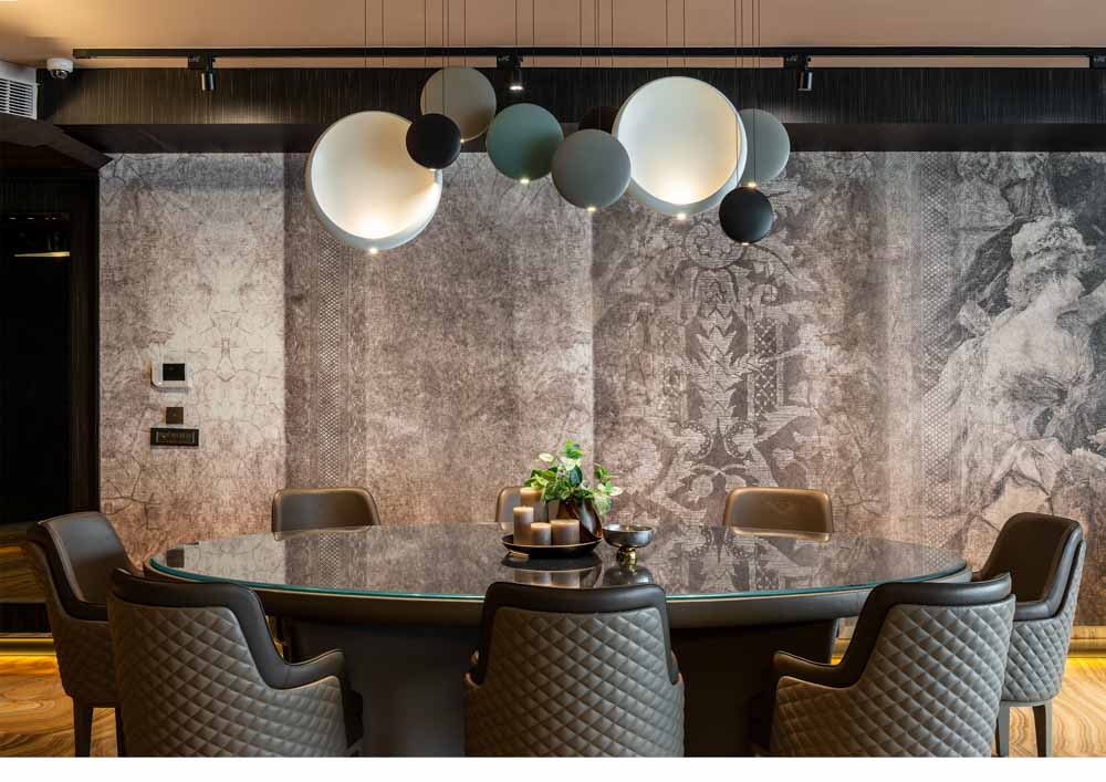A grungy gray dining room interior design with stunning pendant lights - Beautiful Homes