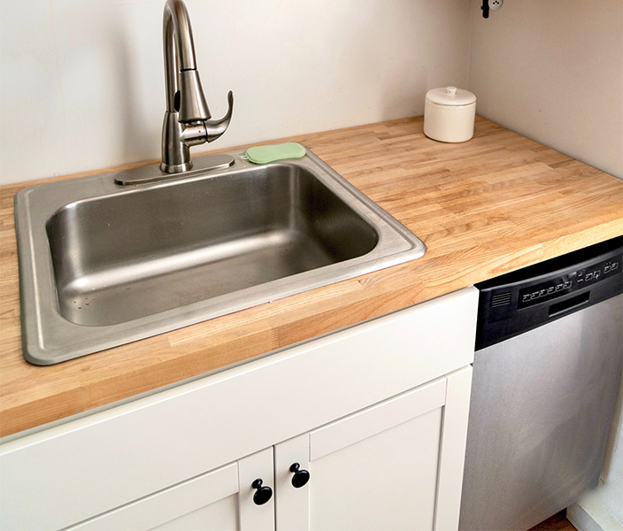 Stainless steel kitchen design design on w wooden kitchen countertop - Beautiful Homes