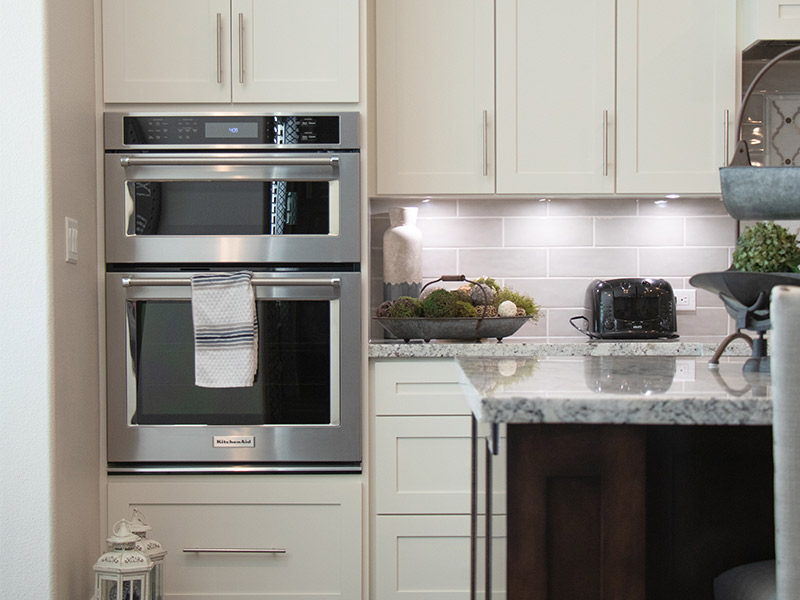 White modular kitchen with built-in oven for modern Indian kitchens - Beautiful Homes