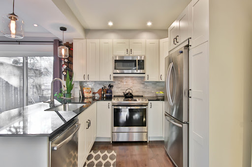 U shaped modular kitchen with built-in refrigerator & kitchen appliances - Beautiful Homes