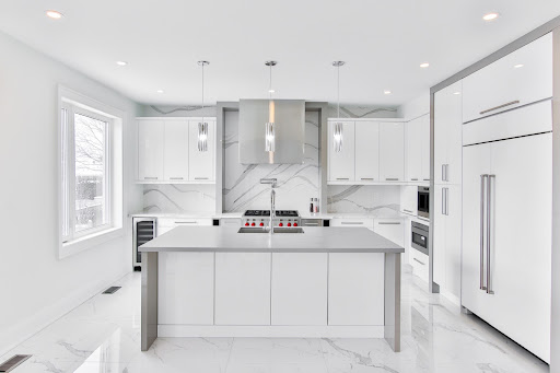 Sleek & steel modern parallel kitchen design with white colour palette - Beautiful Homes