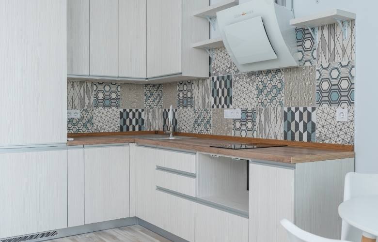 Patterned moroccan wall tiles for your all white kitchen interiors - Beautiful Homes