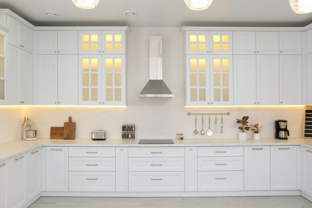 All white u shaped modular kitchen design with lighting - Beautiful Homes