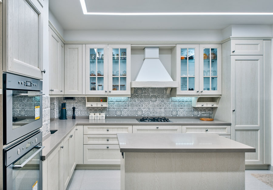 White Kitchen With Pattern Tiles and Slab In The Center- Beautiful Homes