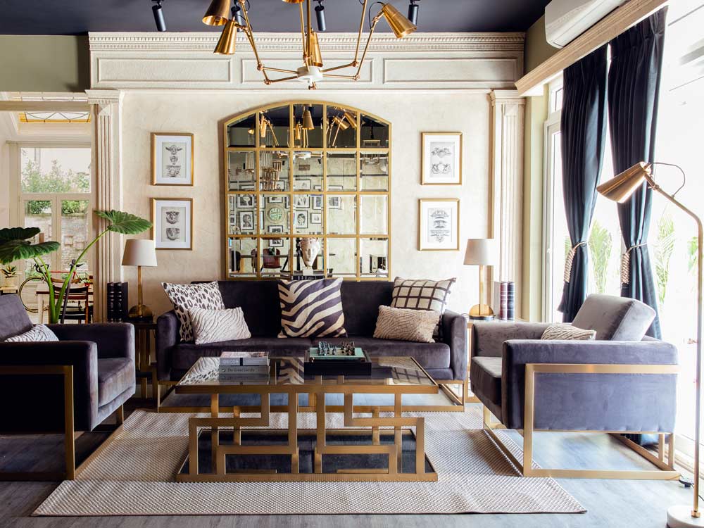 Elegant drawing room interiors with brass décor coffee table, lamps & seatings - Beautiful Homes