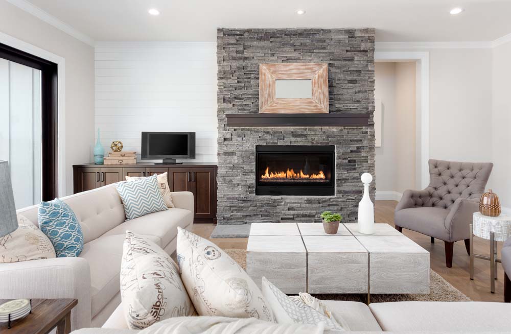 Beautiful raw stoned fireplace in the minimalistic living room design - Beautiful Homes