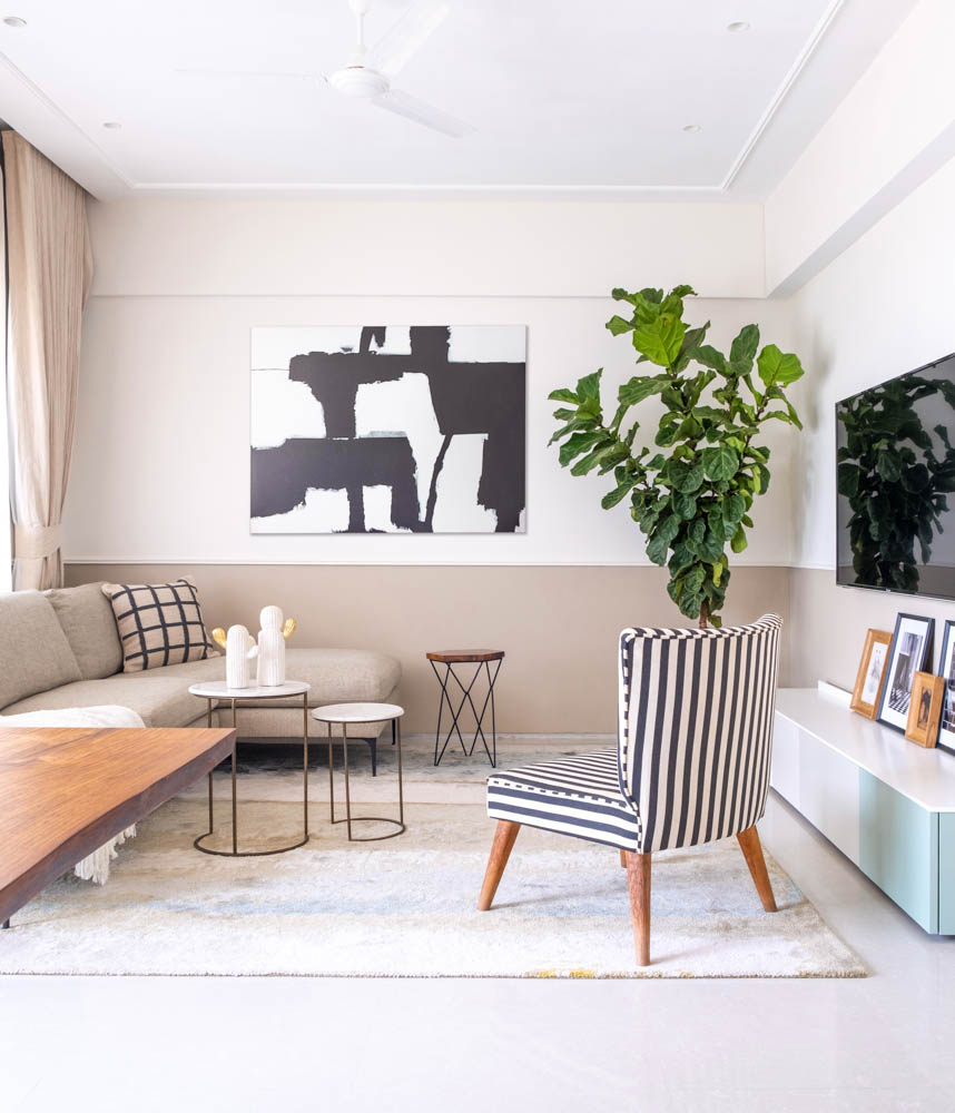Small side of l shaped sofa arranged against the wall in this living room - Beautiful Homes