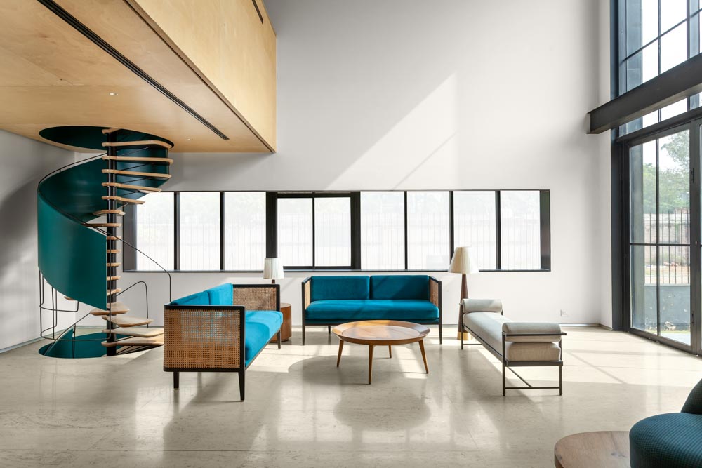 Sofa set & bench arranged around center table in this living room - Beautiful Homes