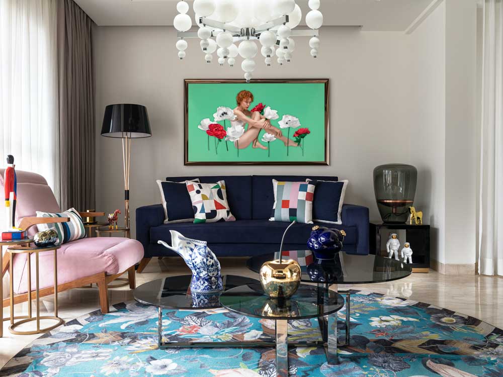 Sofa & seating arranged around the round area rug in the living room - Beautiful Homes