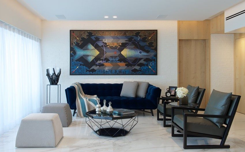 Corner of the living room decorated with a statement piece like an antique with spotlight by a pendant light - Beautiful Homes