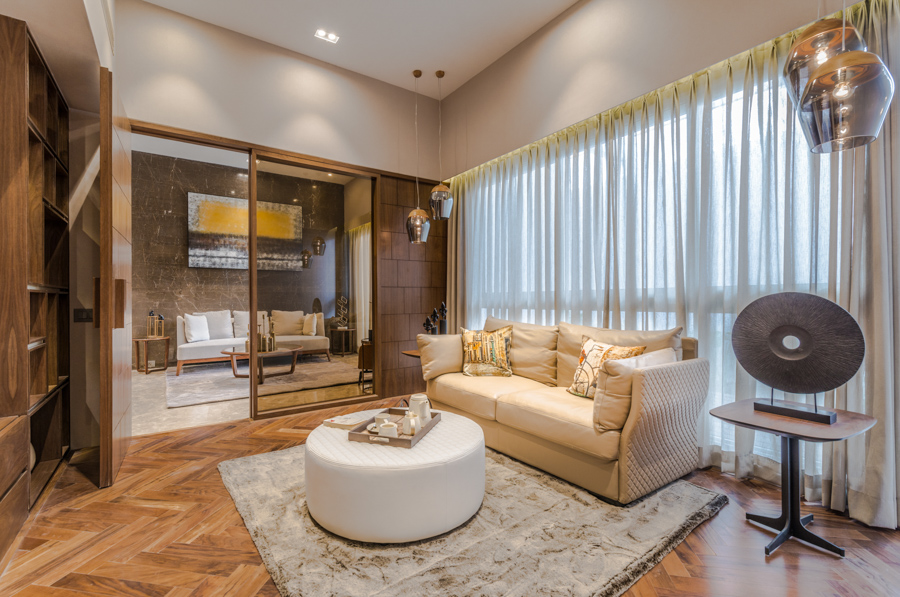 Sectional family room design with classy and modern furniture separated by a sliding door 