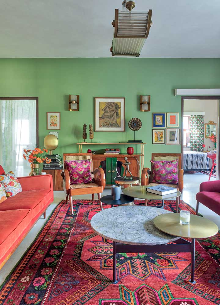 Green Living Room Walls & Floral printed Carpet, Velvet couches in Orange & Pink - Beautiful Homes