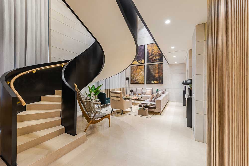 Design your staircase at the home's entrance with a monochrome palatte - Beautiful Homes