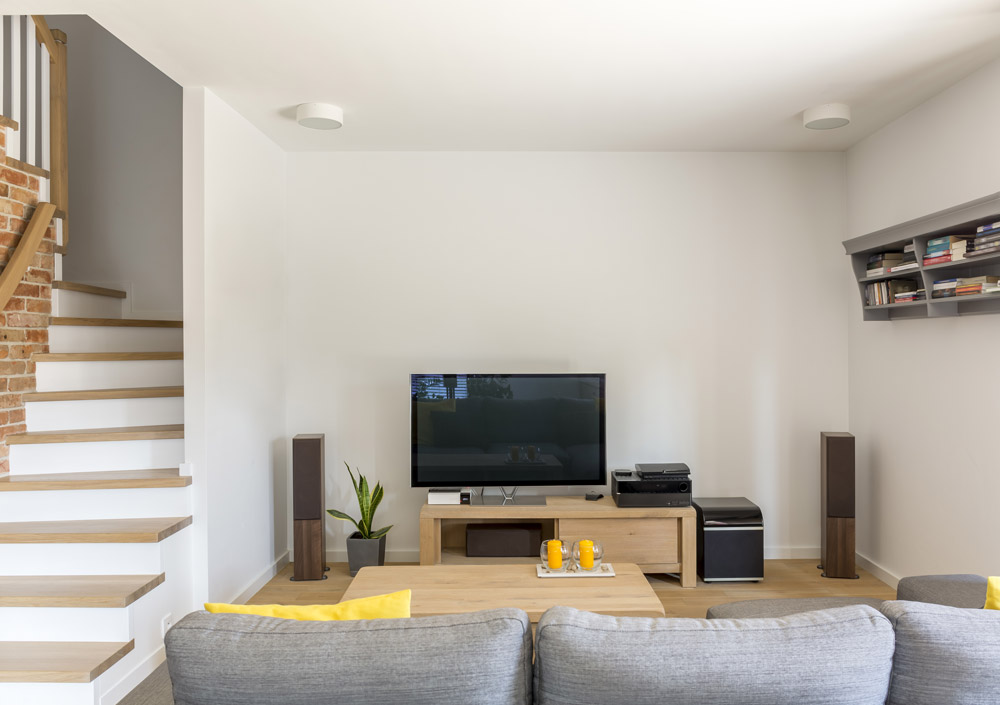 With a simple stair design & warm colours you can add texture to living room design - Beautiful Homes