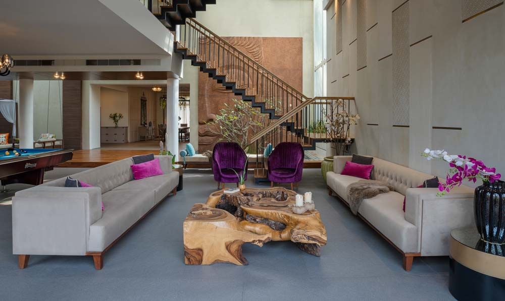 Staircase in the living room can serve as a backdrop focal point  - Beautiful Homes