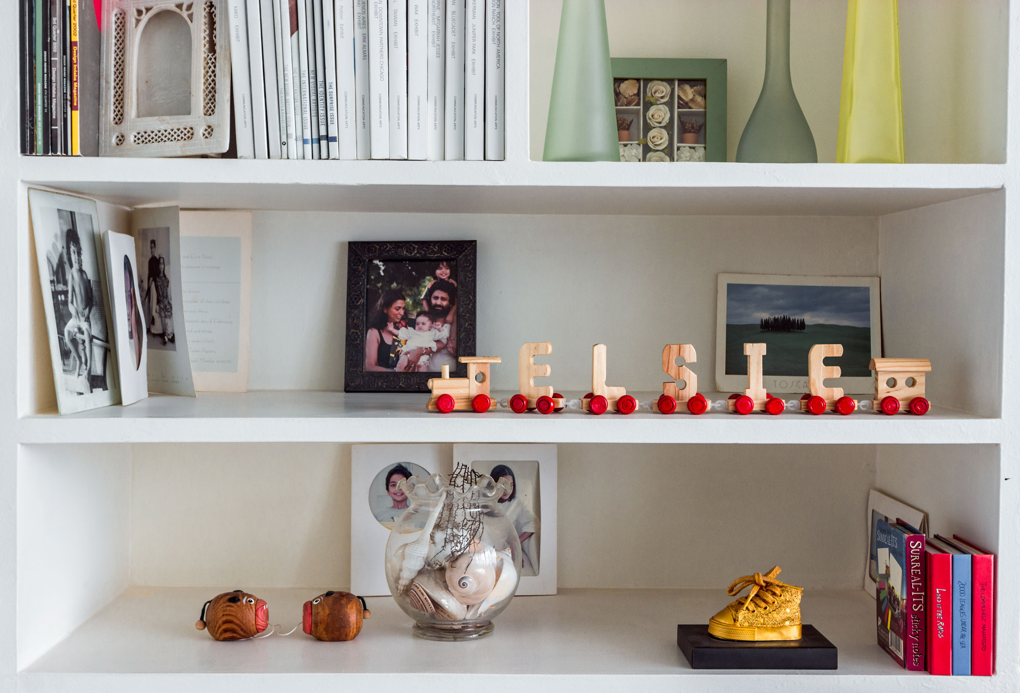 A close-up of the open shelves surrounding the workspace - Beautiful Homes