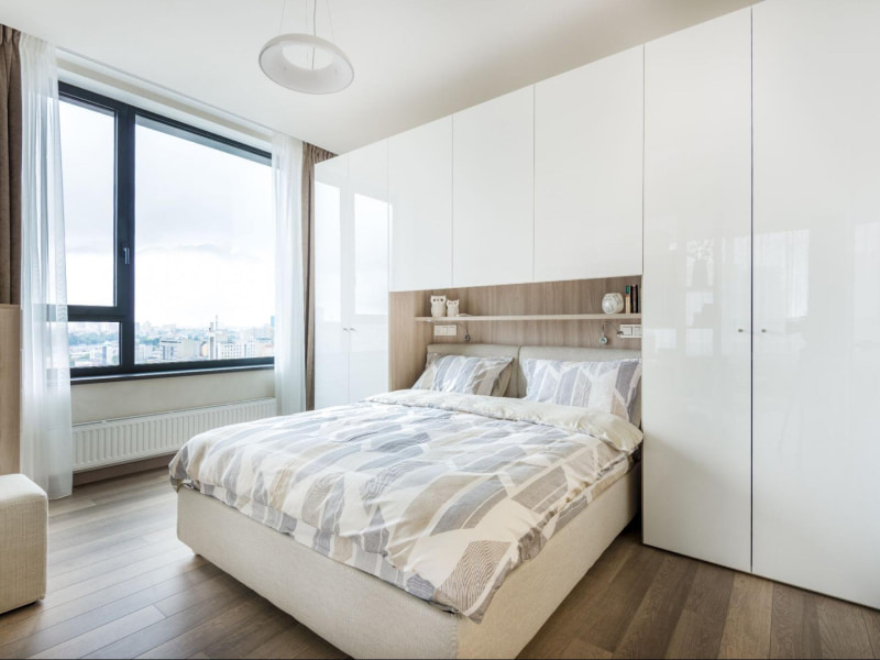 Minimalistic bookshelves used as bedroom wall décor for storage purposes - Beautiful Homes